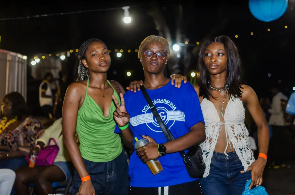 Three friends posing under the lights at The Hangawt