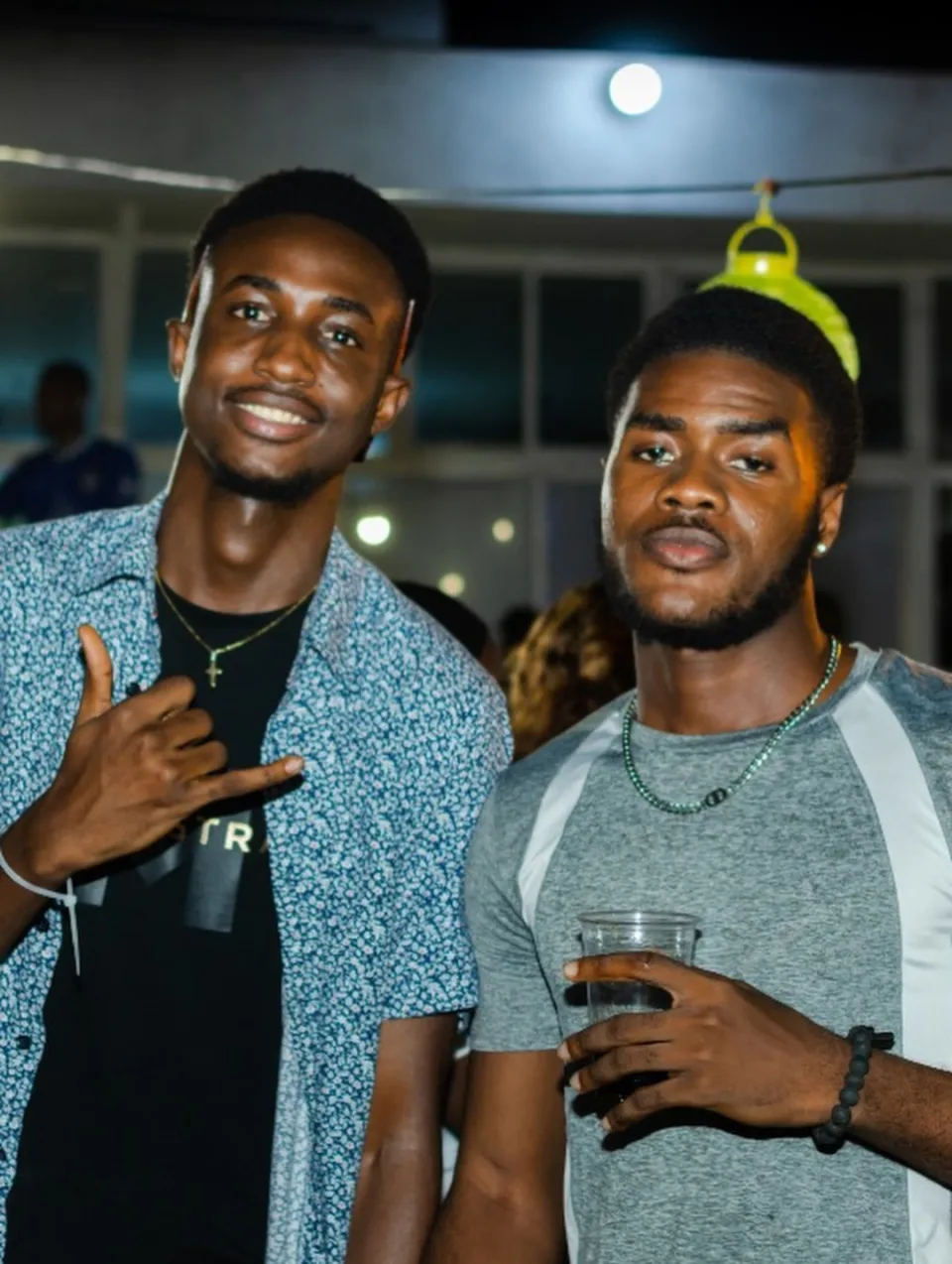 Two friends smiling for a photograph at The Hangawt